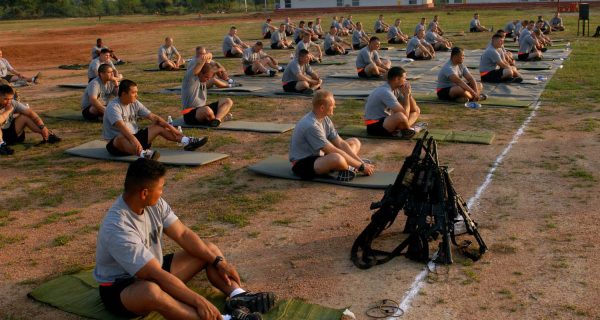 Soldiers assigned to Troop B, 2nd Squadron, 14th Cavalry Regiment, "Strykehorse," 2nd Stryker Brigade Combat Team, 25th Infantry Division listen to a yoga instructor during their yoga session at Camp Bundela in Babina, India, Oct. 11. The instruction is part of a cultural exchange between the Indian Army and the U.S. Army. The Soldiers are in India in support of Exercise Yudh Abhyas 09. YA09, which is scheduled for Oct. 12-27, is a bilateral exercise involving the Armies of India and the United States. The primary goal of the exercise is to develop and expand upon the relationship between the Indian and U.S.